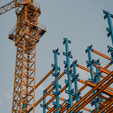 A construction crane with some steel beams.